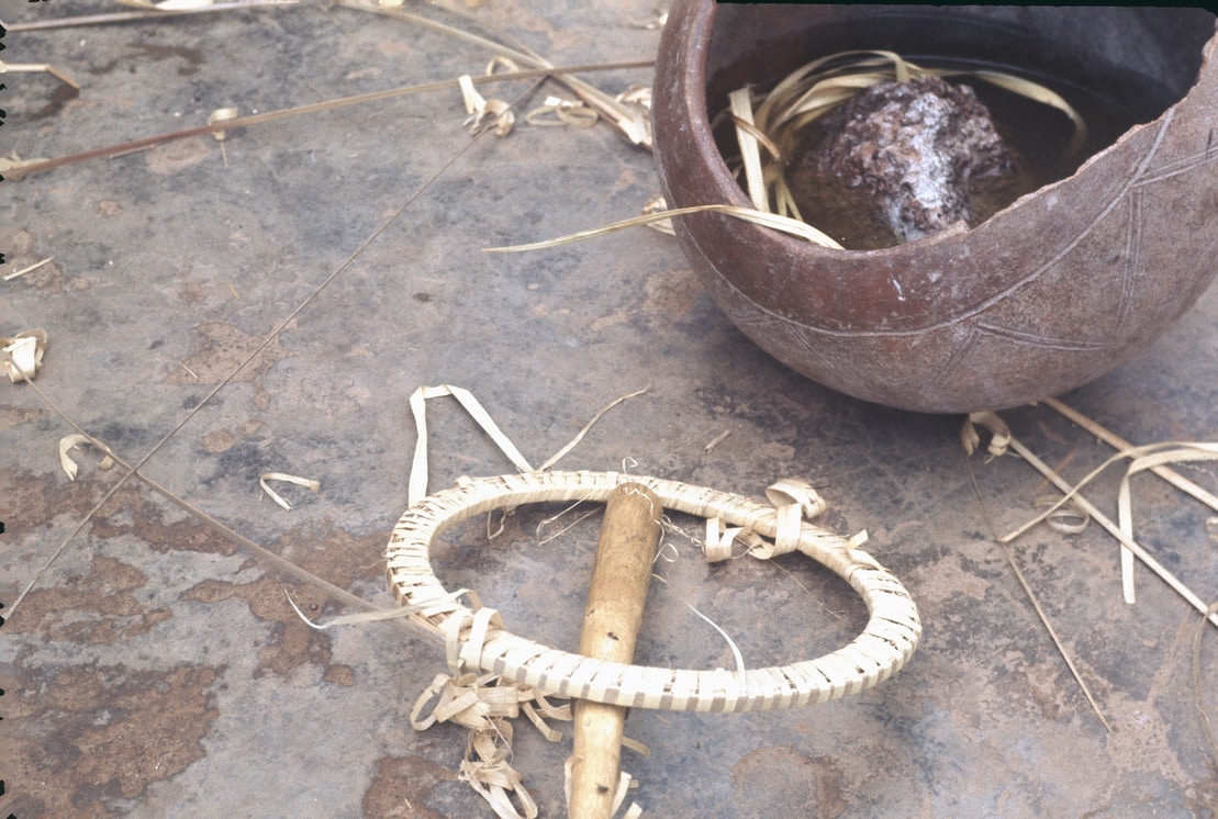 clay pot with raffia soaking