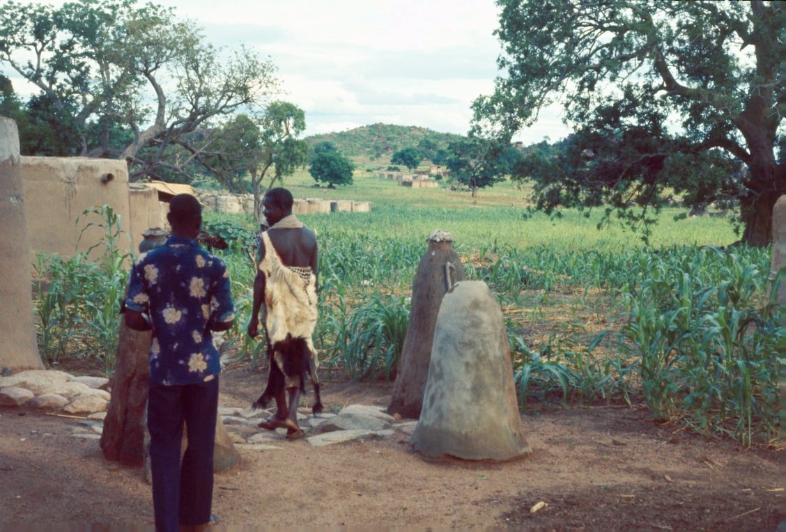 tindana outside his house